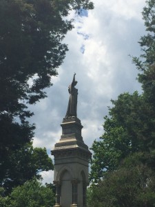 An angel over Daisy Wiliams' final resting places raises her arm to the sky.